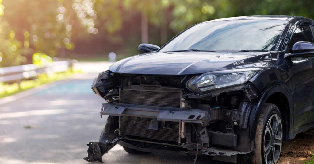 Front side view of a car with front-end damage from a car accident
